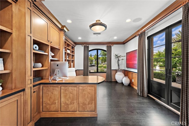 unfurnished office featuring ornamental molding and dark hardwood / wood-style floors