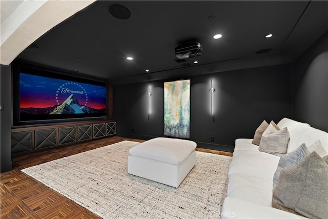 home theater with dark parquet floors