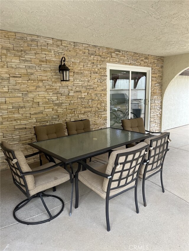 dining room featuring a textured ceiling