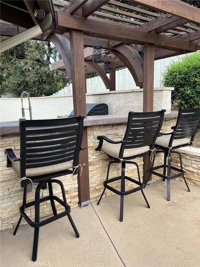 view of patio / terrace with a bar