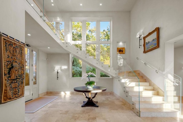 foyer with a towering ceiling