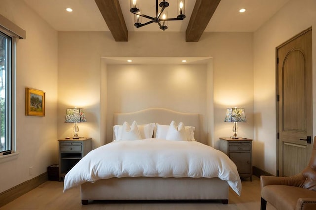 bedroom with a notable chandelier, light hardwood / wood-style flooring, and beamed ceiling