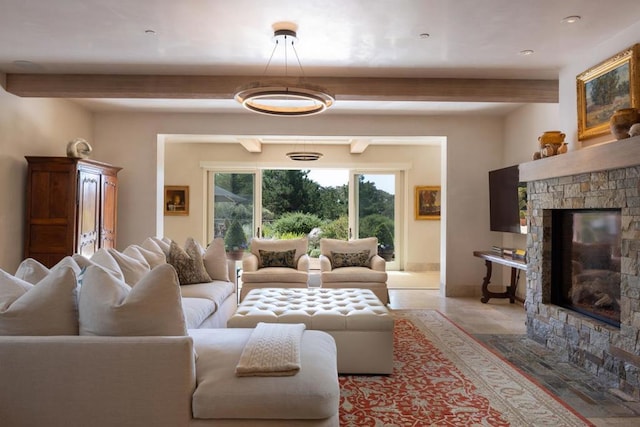 living room featuring a fireplace and beamed ceiling