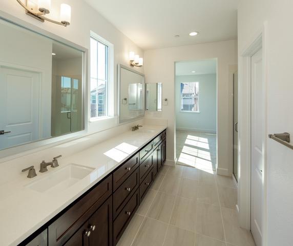 bathroom with vanity, tile patterned flooring, and plenty of natural light