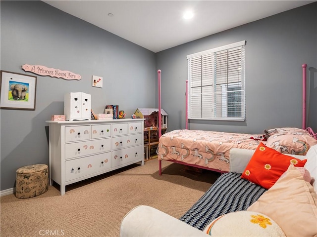 bedroom featuring light carpet