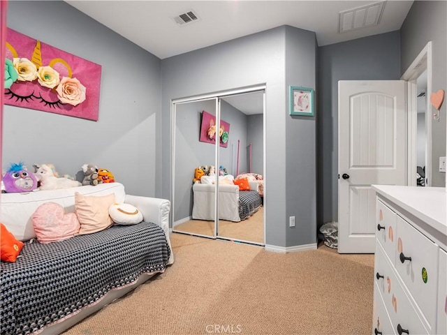 carpeted bedroom with a closet