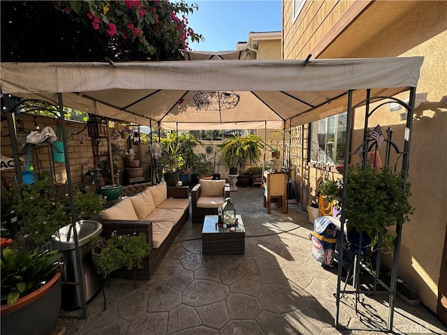 view of patio / terrace featuring an outdoor hangout area and a gazebo