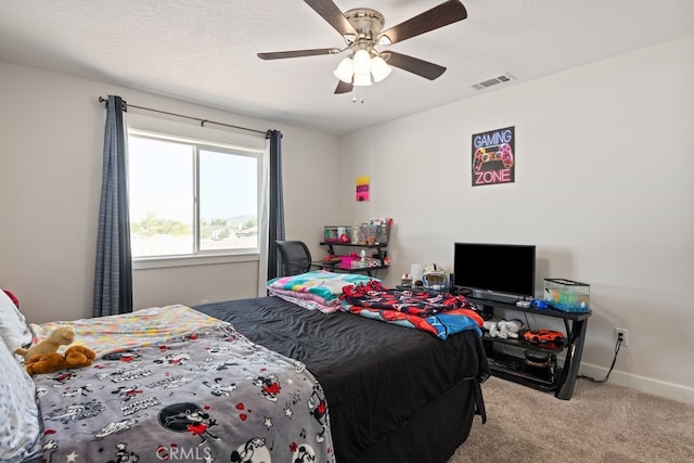 carpeted bedroom with ceiling fan