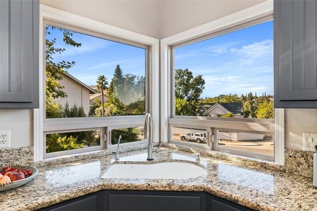 unfurnished sunroom with sink