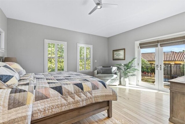 bedroom with french doors, ceiling fan, light hardwood / wood-style flooring, and access to outside