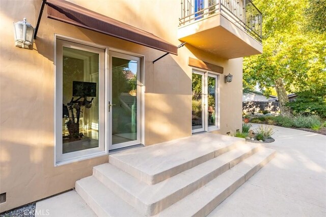 doorway to property featuring a patio area