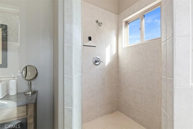 bathroom with a tile shower