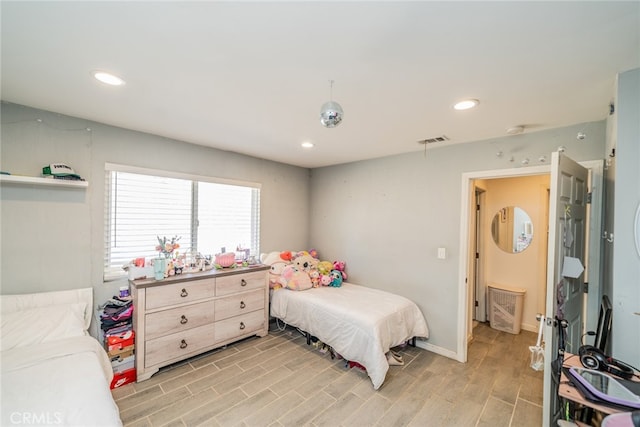 bedroom with light hardwood / wood-style floors