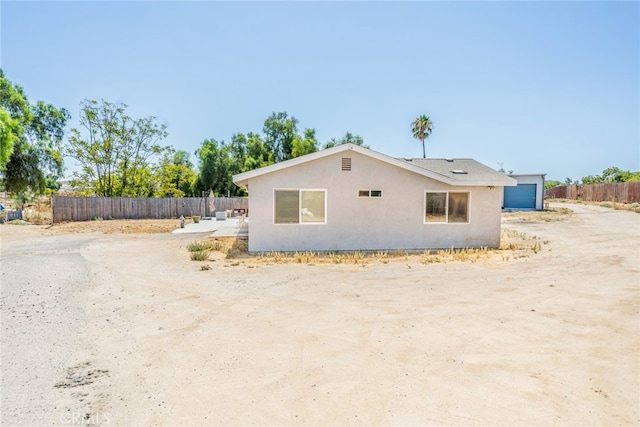 view of side of property featuring a garage