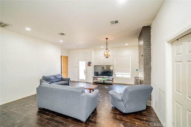 living room with visible vents, dark wood finished floors, and recessed lighting