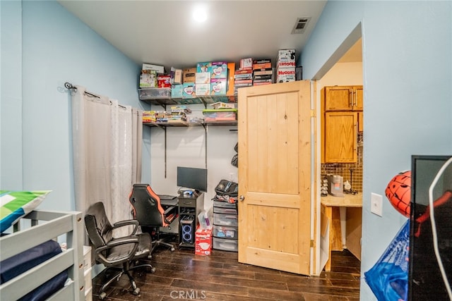 office with dark hardwood / wood-style floors