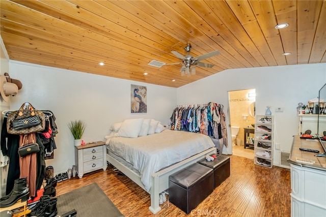 bedroom with wood ceiling, dark wood-type flooring, lofted ceiling, ensuite bath, and ceiling fan