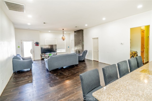 living room featuring dark wood-type flooring