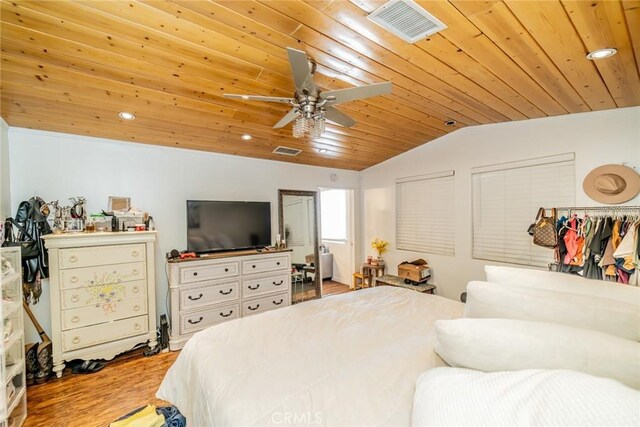 bedroom with wood ceiling, light wood-type flooring, vaulted ceiling, and ceiling fan