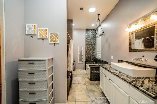 bathroom with independent shower and bath and vanity