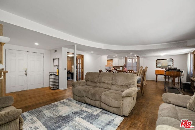 living room with dark hardwood / wood-style flooring