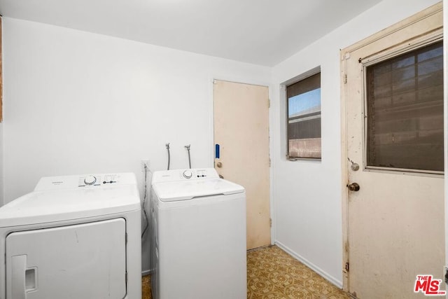 clothes washing area featuring washer and dryer