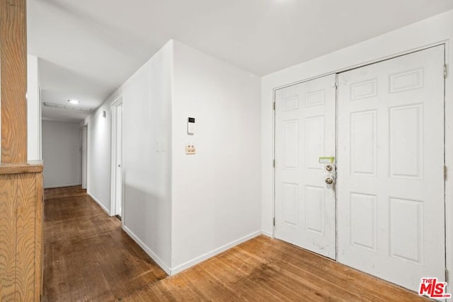 foyer entrance with hardwood / wood-style flooring