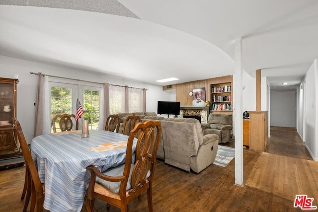 dining space with dark hardwood / wood-style floors