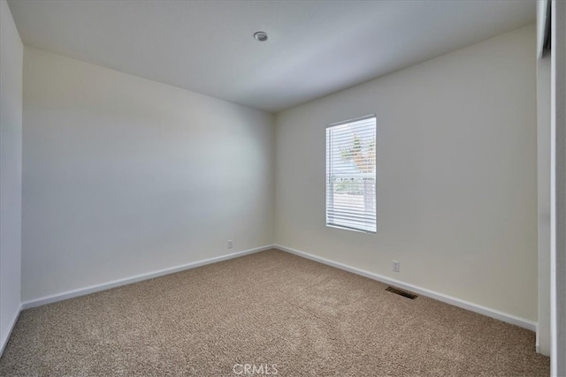 spare room featuring carpet flooring