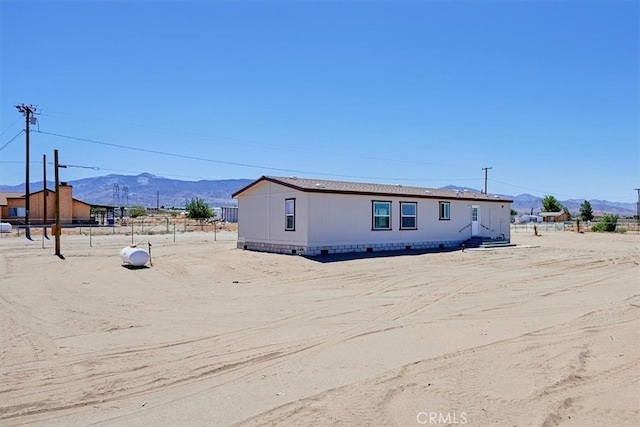 view of front of property with a mountain view