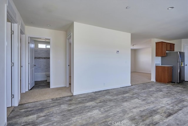 unfurnished living room with hardwood / wood-style flooring