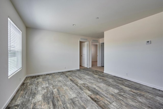 spare room featuring hardwood / wood-style floors