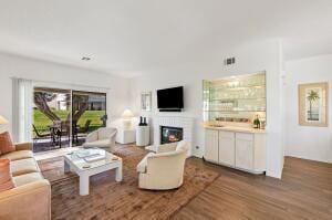 living room with dark wood-type flooring