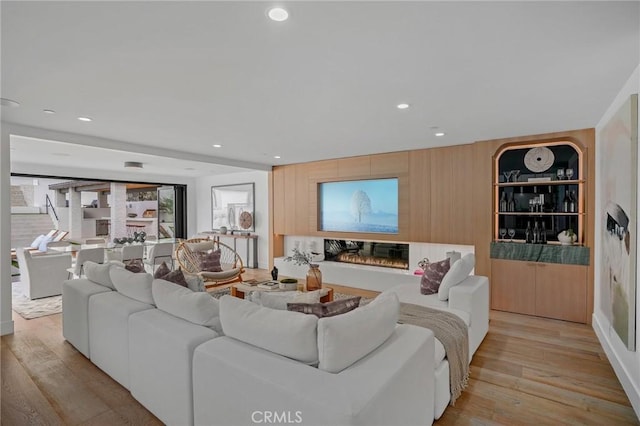 living room with light hardwood / wood-style flooring