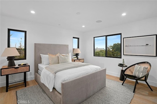 bedroom with light hardwood / wood-style flooring