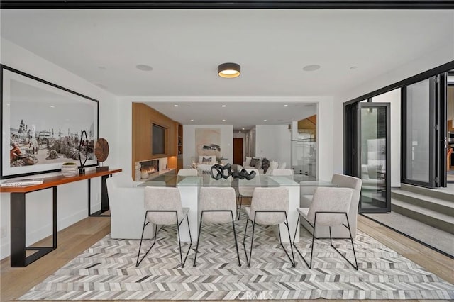 dining area with light hardwood / wood-style flooring