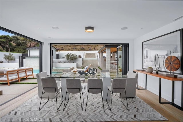 dining area with light hardwood / wood-style flooring