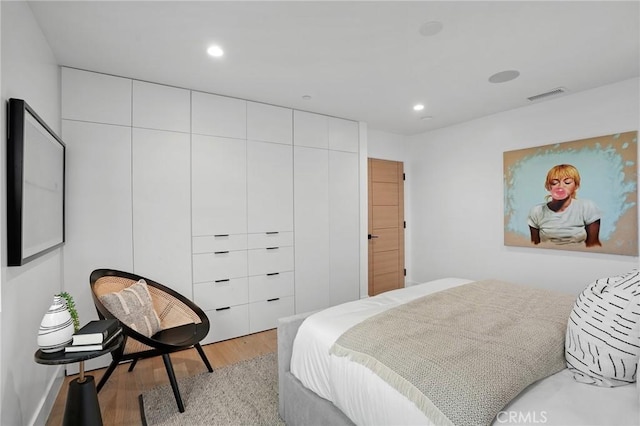 bedroom featuring light hardwood / wood-style floors