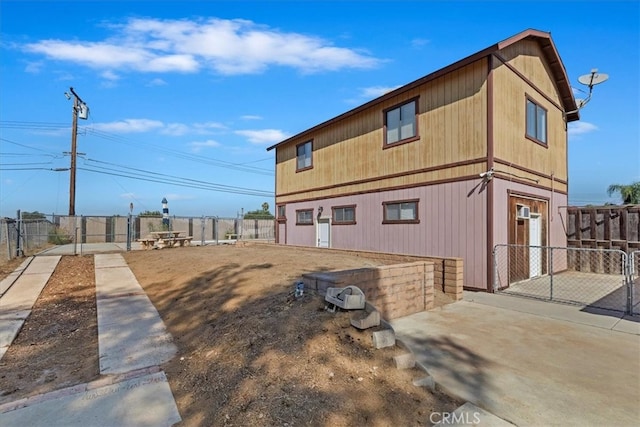 view of side of property with a patio