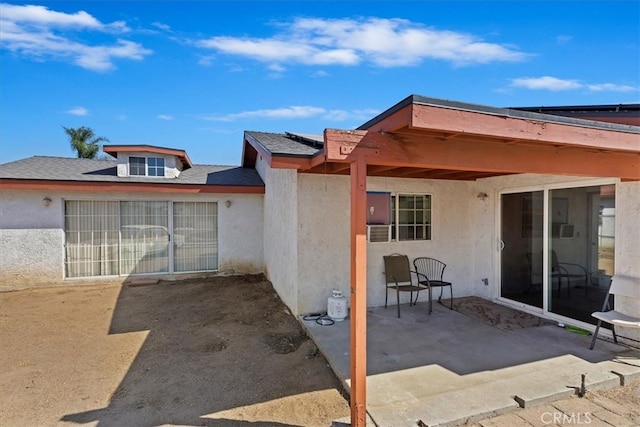 back of property with a patio area