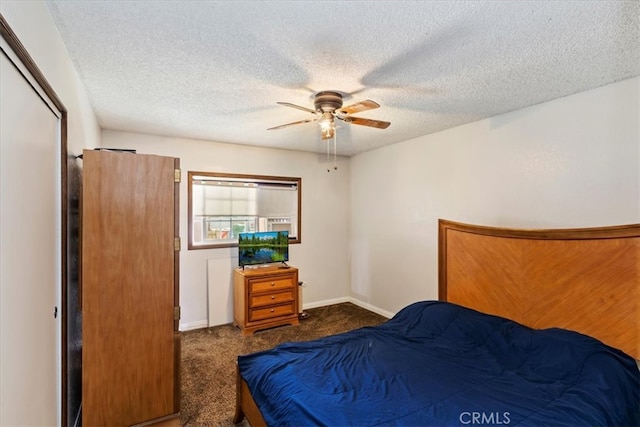 bedroom with dark colored carpet, a closet, a textured ceiling, and ceiling fan