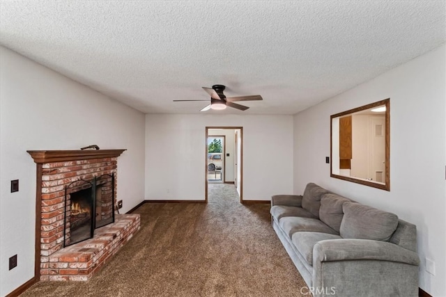 carpeted living room with a textured ceiling, a fireplace, and ceiling fan