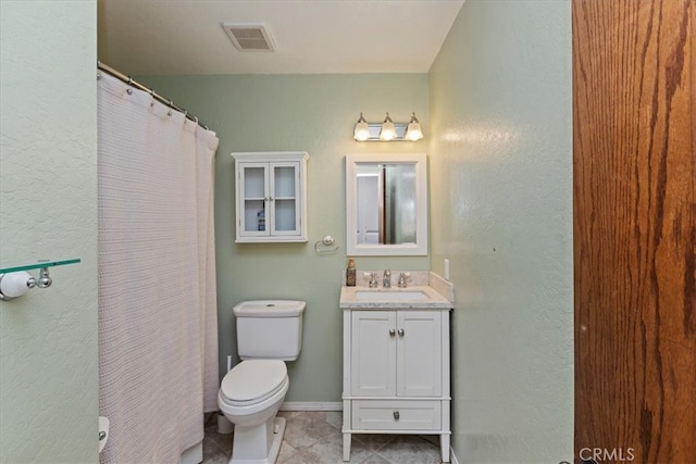 bathroom with vanity, toilet, a shower with curtain, and tile patterned flooring