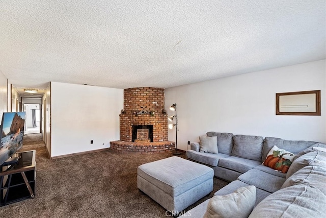 living room with a textured ceiling, dark carpet, and a brick fireplace