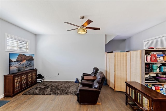 sitting room featuring ceiling fan and hardwood / wood-style flooring