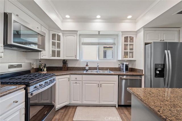 kitchen featuring light hardwood / wood-style floors, sink, white cabinetry, and stainless steel appliances