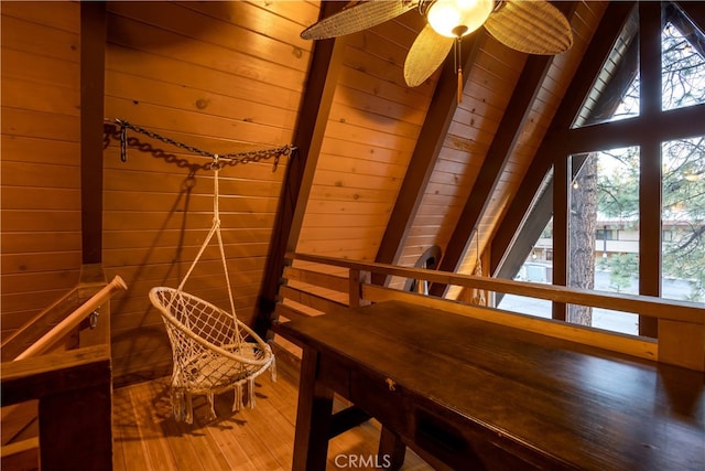 interior space with wooden ceiling, wood walls, and hardwood / wood-style flooring