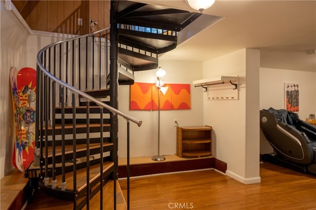 stairway with hardwood / wood-style floors