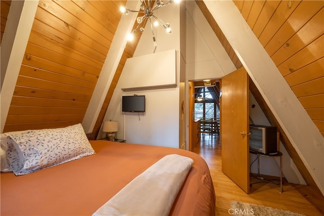 bedroom featuring light hardwood / wood-style flooring, a chandelier, high vaulted ceiling, and wooden ceiling