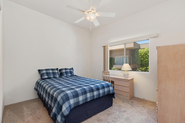 bedroom with light carpet, a closet, and ceiling fan